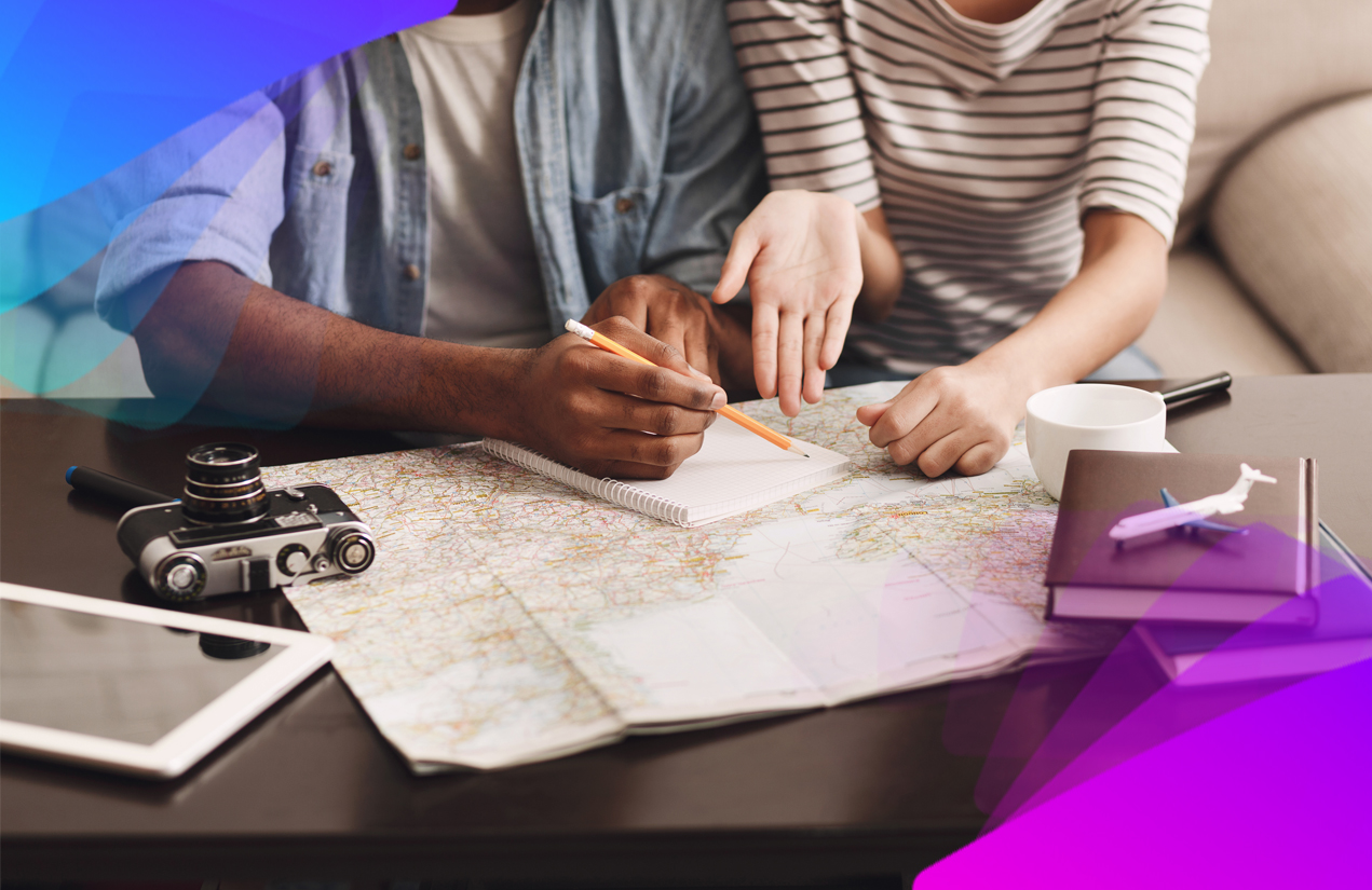A man and a woman looking over a map